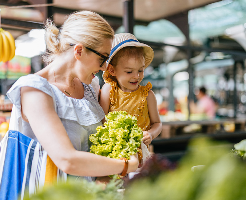 mother and daughter at farmer's market