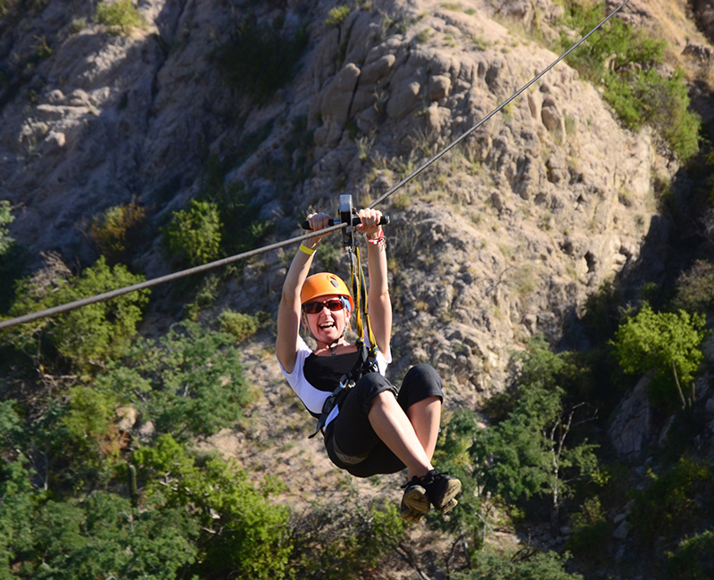 a woman on a zip line